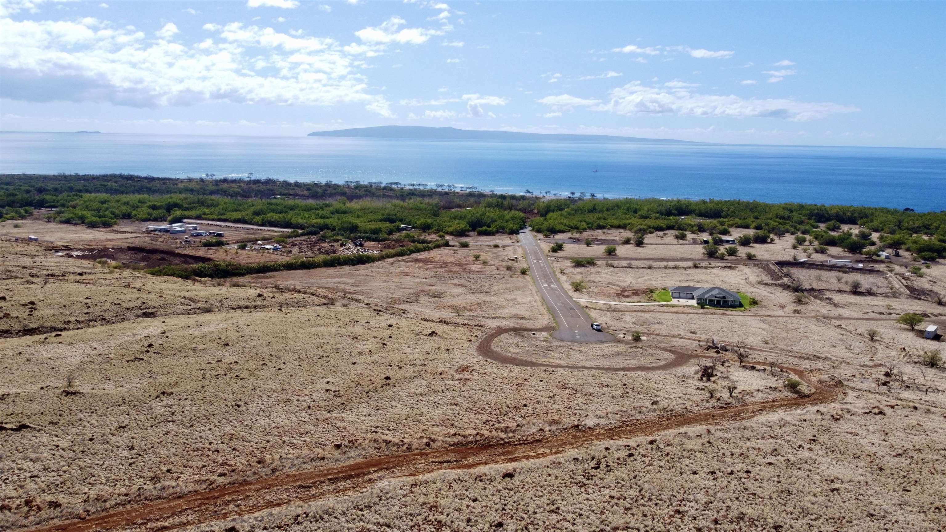 Pohaku Aeko Street, Unit 31A Lahaina, HI 96761 - Photo 10 of 14 a view of a dry yard with wooden fence