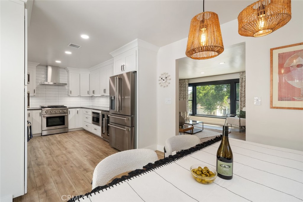 905 Olive Street Paso Robles, CA 93446 - Photo 12 of 61 a kitchen with stainless steel appliances granite countertop a sink a stove and refrigerator