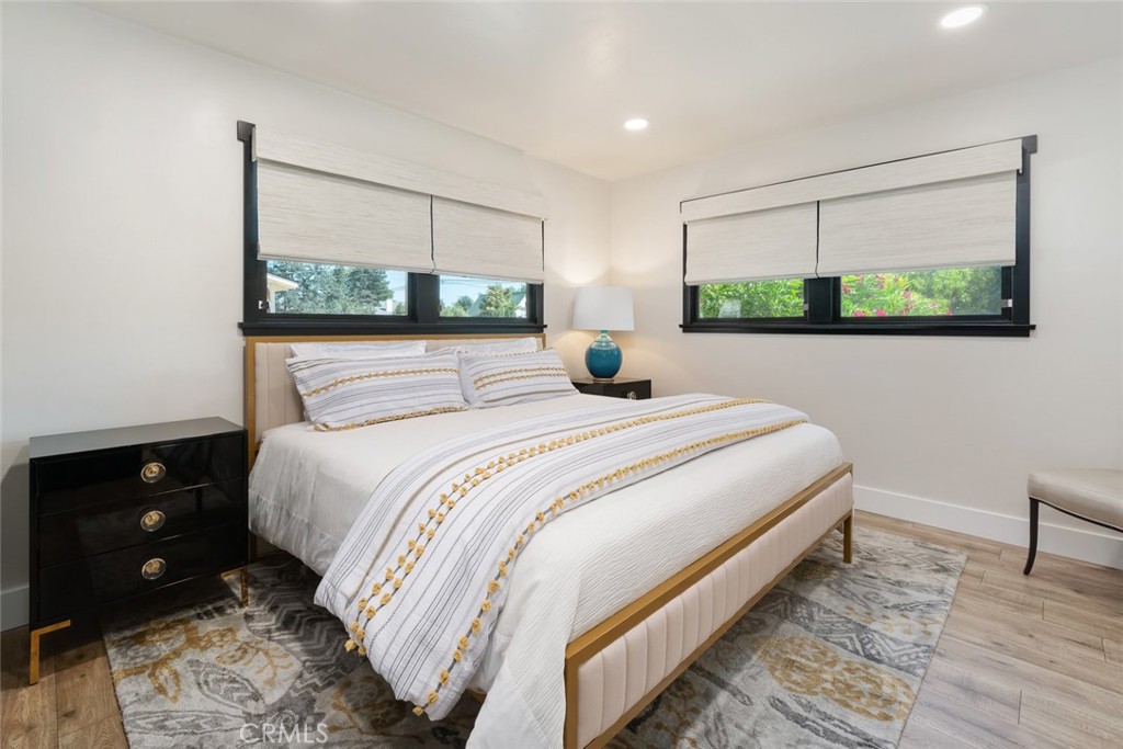 905 Olive Street Paso Robles, CA 93446 - Photo 25 of 61 a bedroom with a bed a lamp and a window