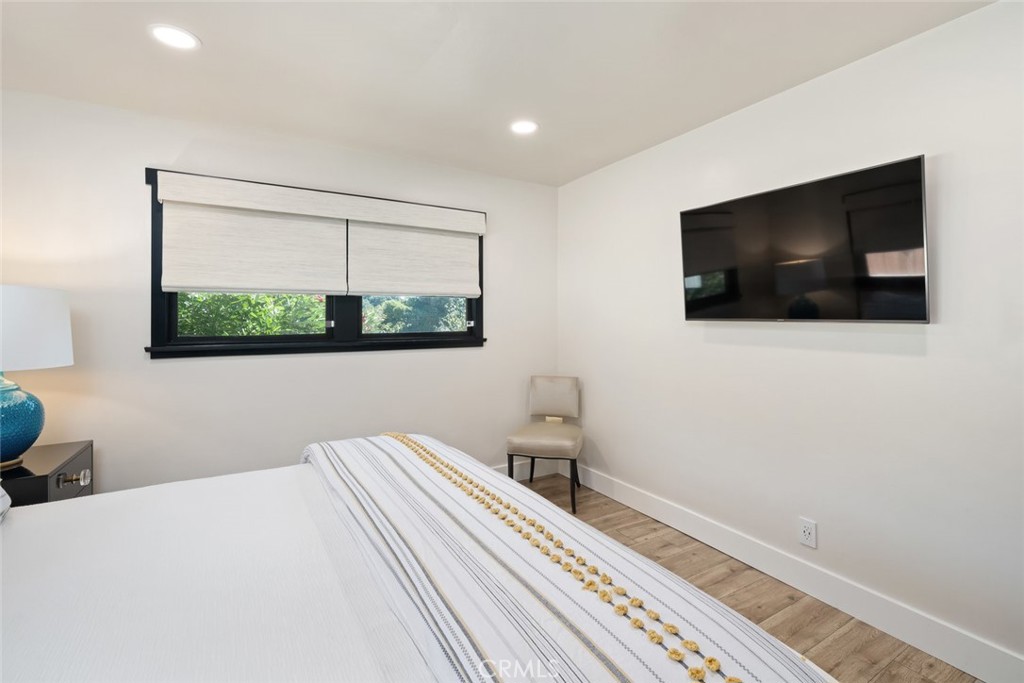 905 Olive Street Paso Robles, CA 93446 - Photo 26 of 61 a bedroom with a bed and a flat screen tv