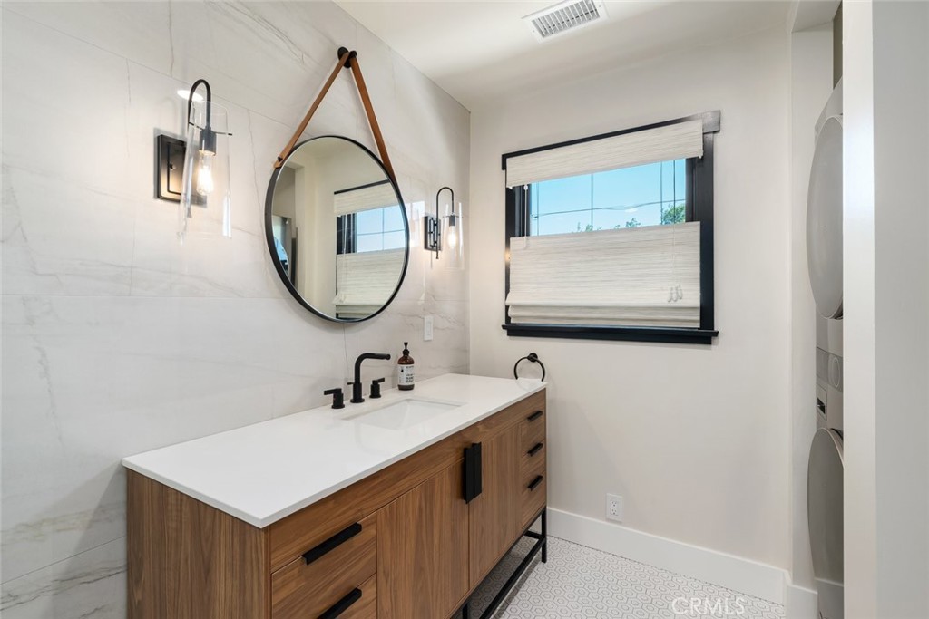 905 Olive Street Paso Robles, CA 93446 - Photo 29 of 61 a bathroom with a sink and a mirror