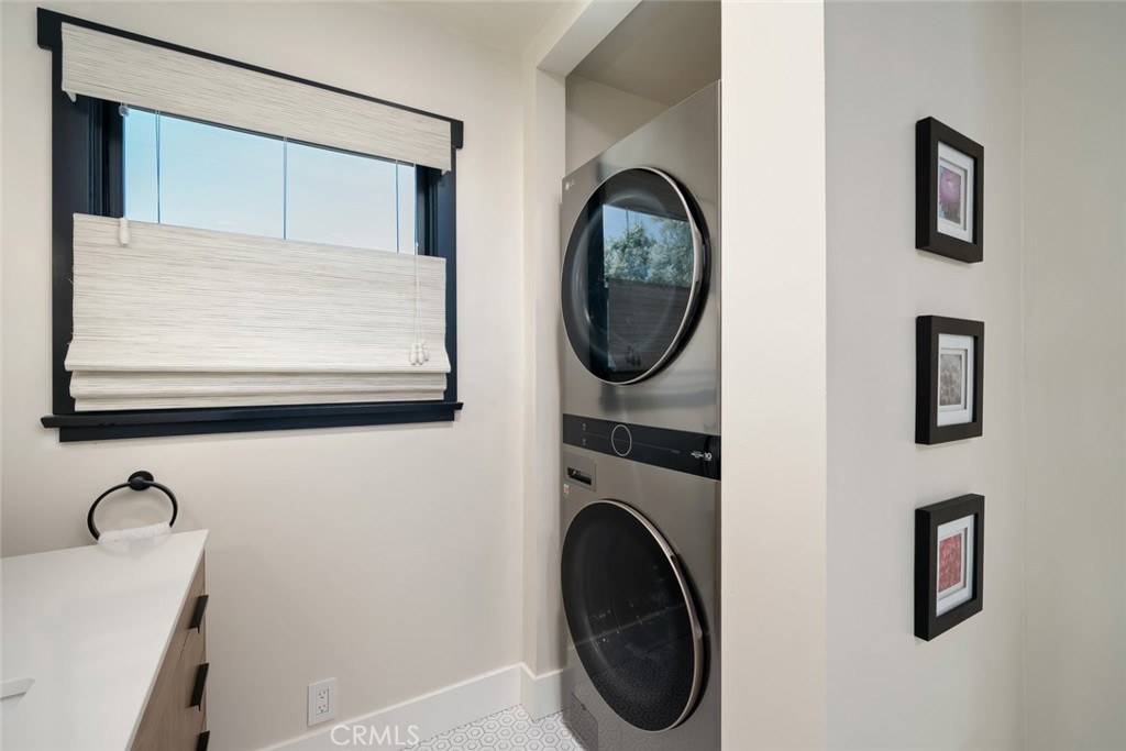 905 Olive Street Paso Robles, CA 93446 - Photo 30 of 61 a view of a hallway with washer and dryer