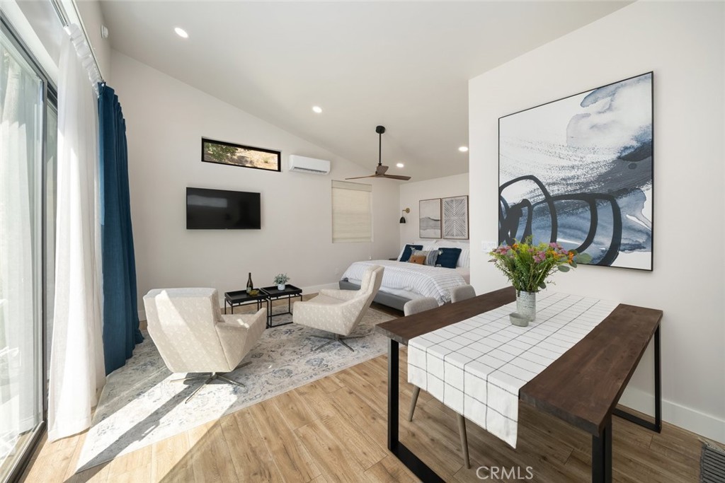 905 Olive Street Paso Robles, CA 93446 - Photo 41 of 61 a living room with furniture wooden floor and a flat screen tv