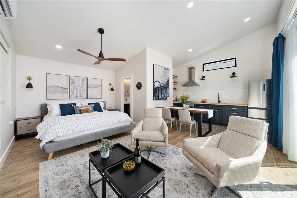 905 Olive Street Paso Robles, CA 93446 - Photo 43 of 61 a living room with furniture and wooden floor