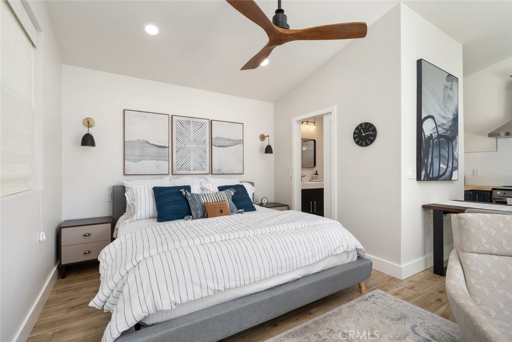 905 Olive Street Paso Robles, CA 93446 - Photo 49 of 61 a bedroom with a bed and a flat screen tv