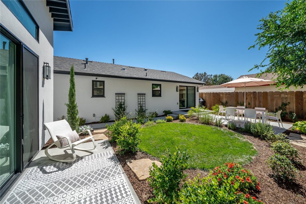 905 Olive Street Paso Robles, CA 93446 - Photo 51 of 61 a view of backyard of house with outdoor seating and green space