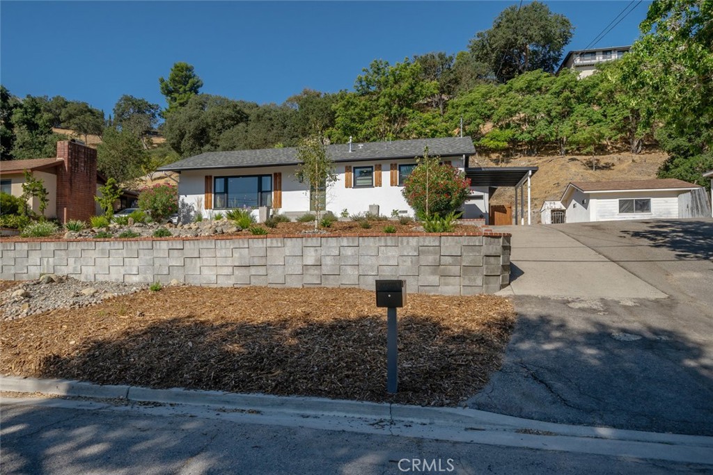 905 Olive Street Paso Robles, CA 93446 - Photo 60 of 61 a front view of a house with a yard