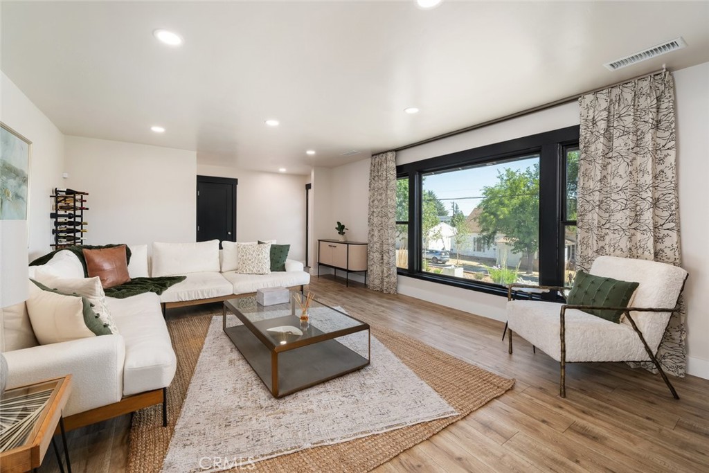 905 Olive Street Paso Robles, CA 93446 - Photo 6 of 61 a living room with furniture and a large window