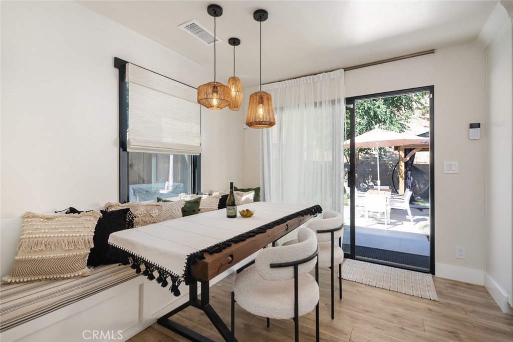 905 Olive Street Paso Robles, CA 93446 - Photo 10 of 61 a view of a dining room with furniture window and wooden floor