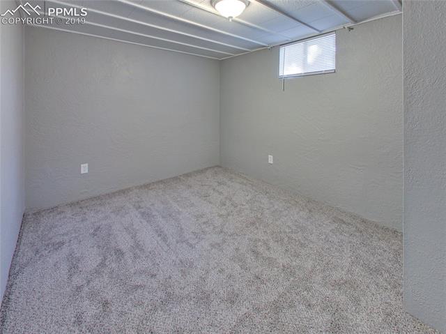 1904 North Chelton Road Colorado Springs, CO 80909 - Photo 22 of 31 Basement Bedroom