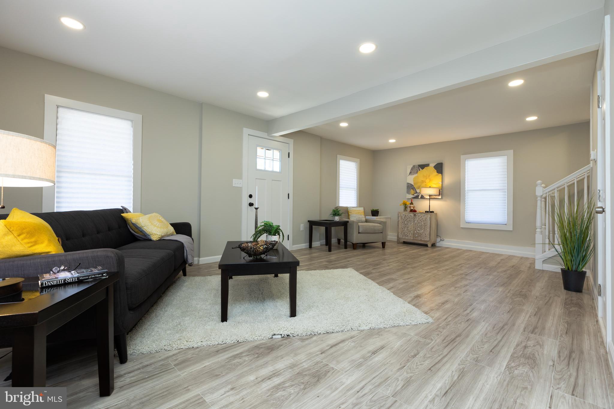 2407 Hammonds Ferry Road Halethorpe, MD 21227 - Photo 14 of 43 a living room with furniture and wooden floor