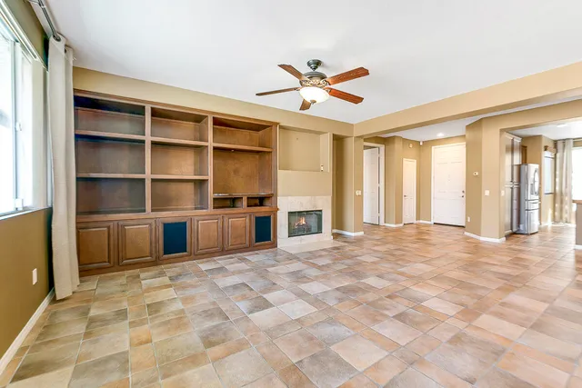 a kitchen with stainless steel appliances granite countertop a stove microwave and cabinets