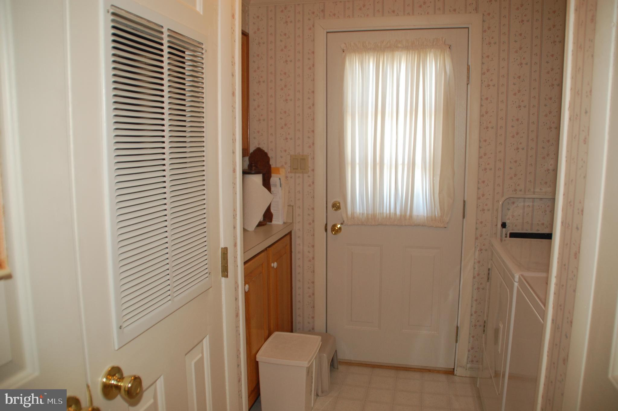 11 Sutton Place Souderton, PA 18964 - Photo 29 of 48 The Laundry Room provides access to to side yard.