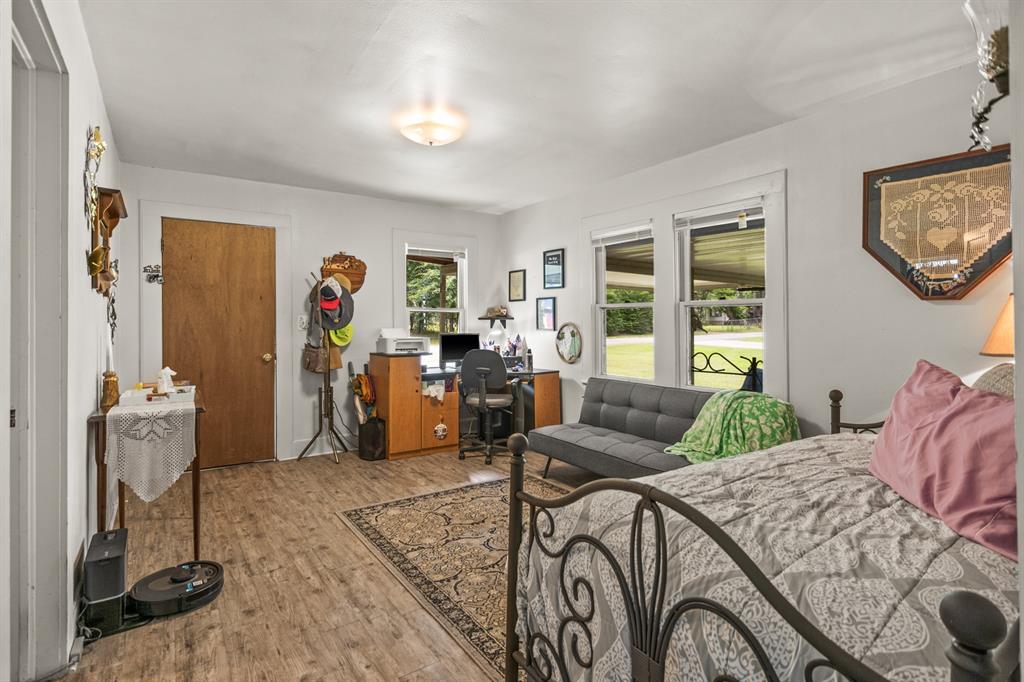 103 South Sun Camp Road White Oak, TX 75693 - Photo 7 of 40 a bedroom with furniture and a window