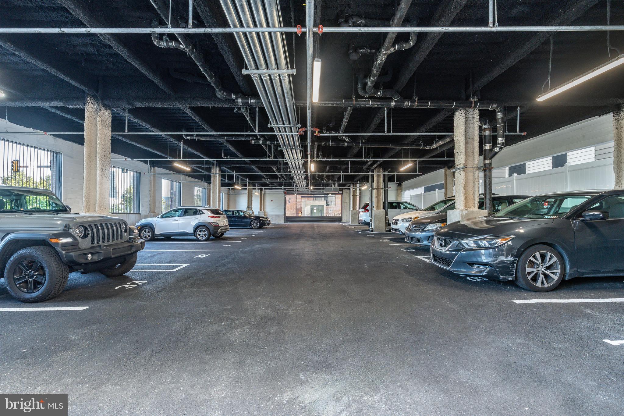 1130 North Delaware Avenue, Unit 307 Philadelphia, PA 19125 - Photo 14 of 30 a view of car garage with cars