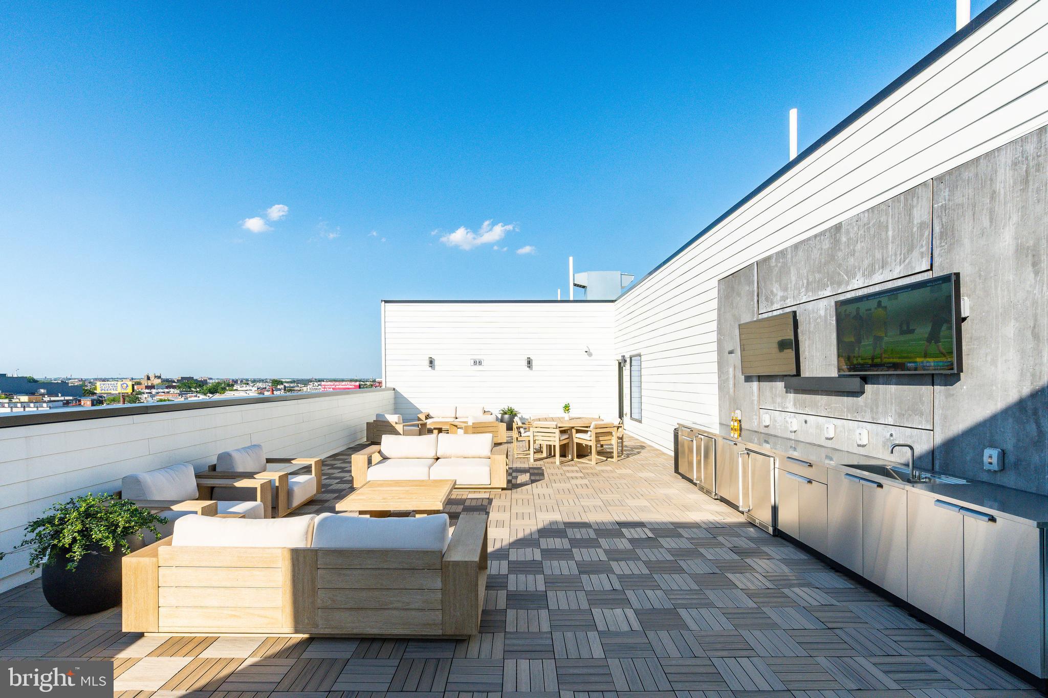 1130 North Delaware Avenue, Unit 307 Philadelphia, PA 19125 - Photo 24 of 30 a living room with furniture kitchen view and a faucet