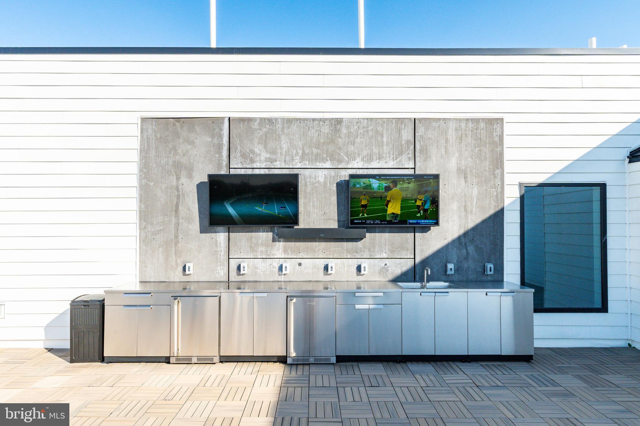 1130 North Delaware Avenue, Unit 307 Philadelphia, PA 19125 - Photo 25 of 30 a living room with a fireplace furniture and a flat screen tv