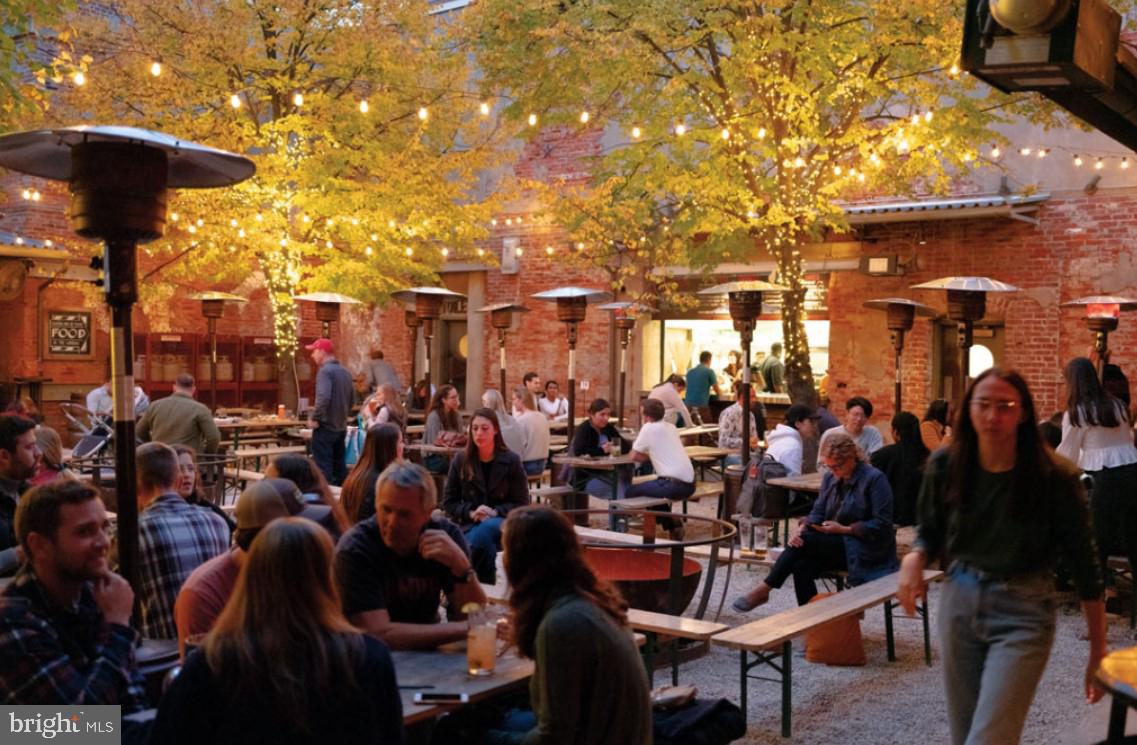 1130 North Delaware Avenue, Unit 307 Philadelphia, PA 19125 - Photo 28 of 30 a group of people sitting in a yard