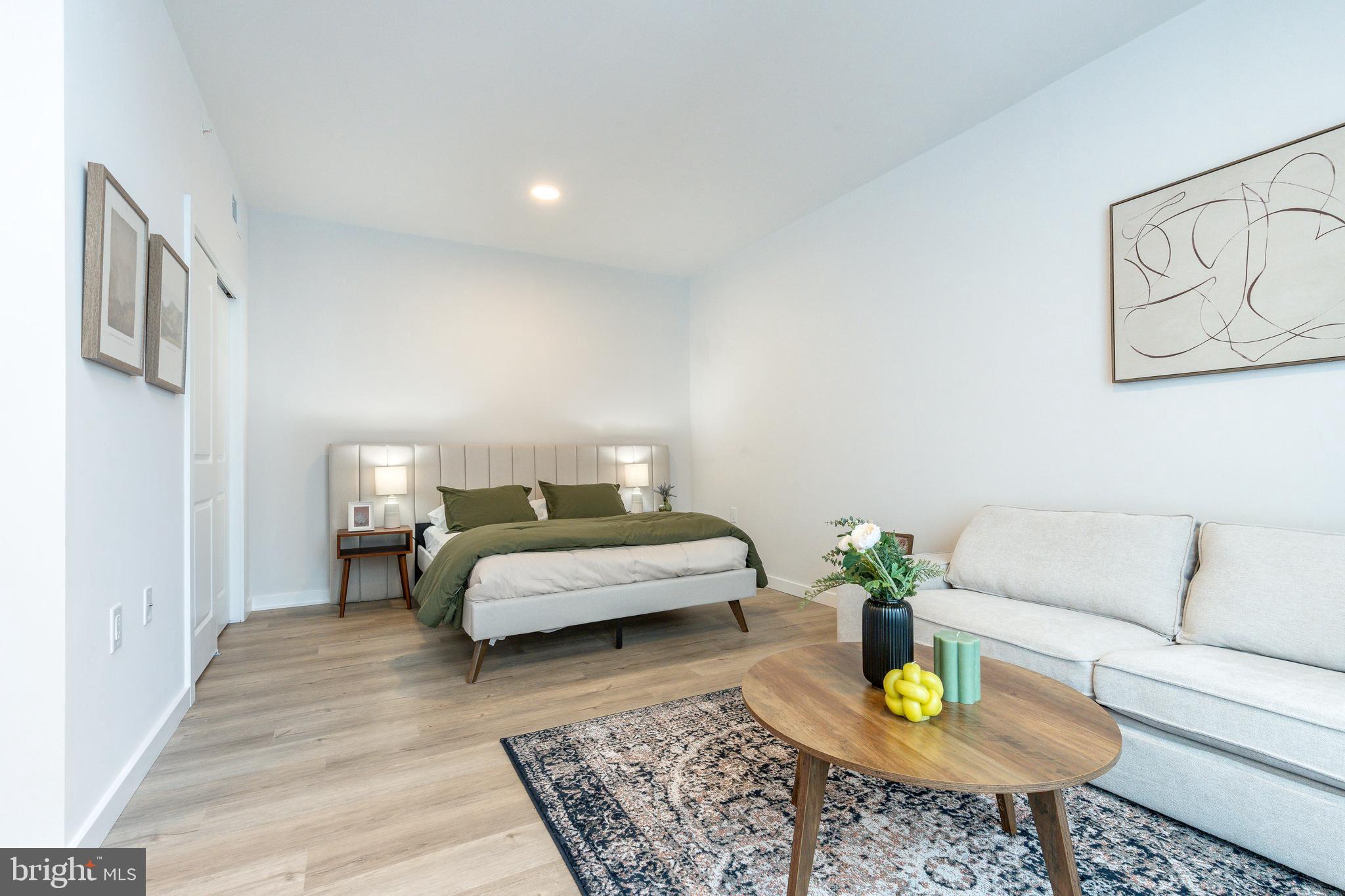 1130 North Delaware Avenue, Unit 307 Philadelphia, PA 19125 - Photo 8 of 30 a living room with furniture and wooden floor