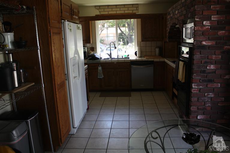 760 Talbert Avenue Simi Valley, CA 93065 - Photo 5 of 12 a kitchen with a sink a refrigerator and window