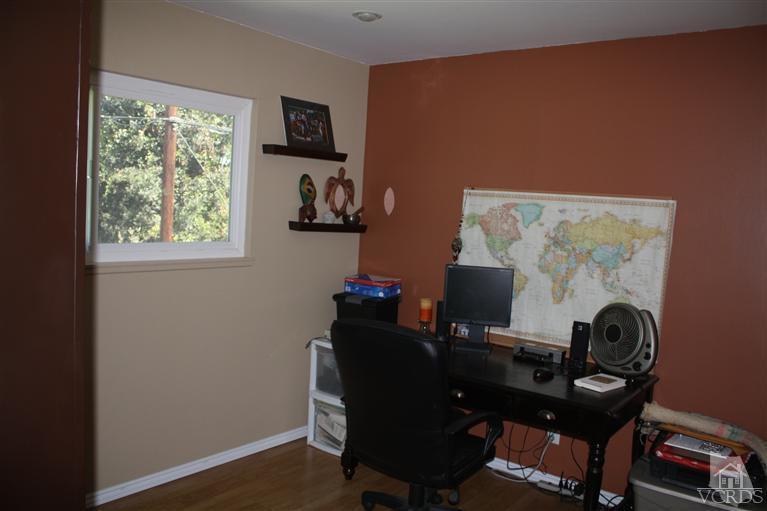 760 Talbert Avenue Simi Valley, CA 93065 - Photo 9 of 12 a view of a workspace with furniture and a window