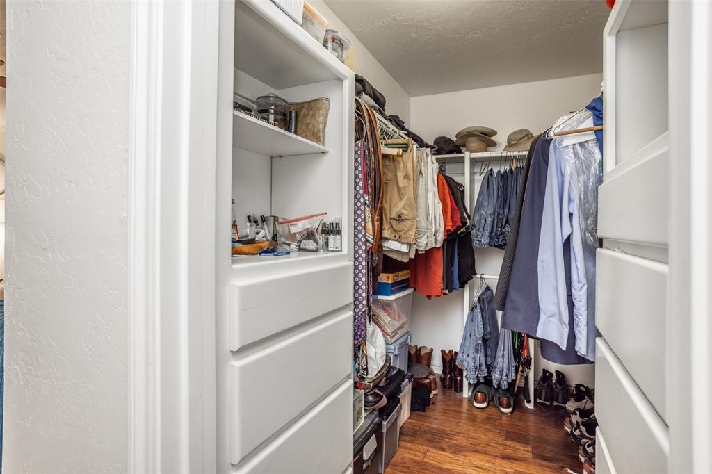 823 Casino Road Nocona, TX 76255 - Photo 21 of 40 a view of walk in closet with clothes and shoes