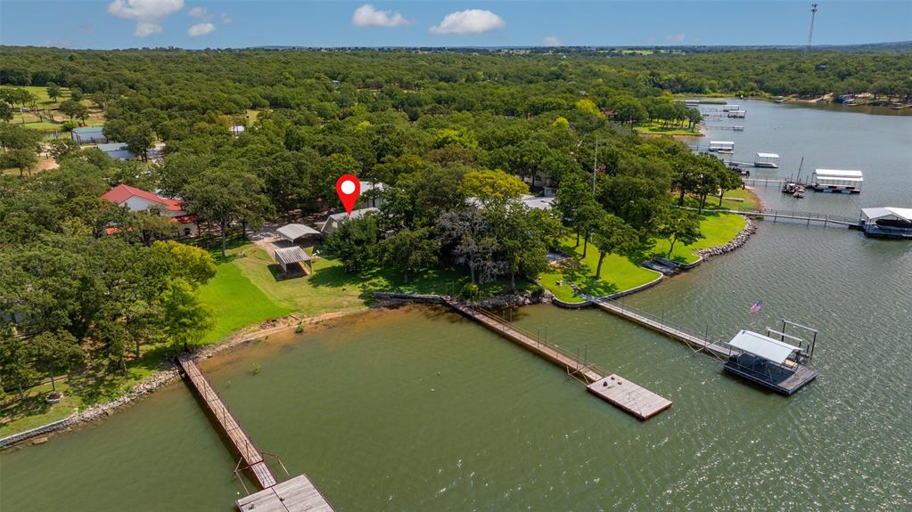 823 Casino Road Nocona, TX 76255 - Photo 3 of 40 an aerial view of a house with a yard