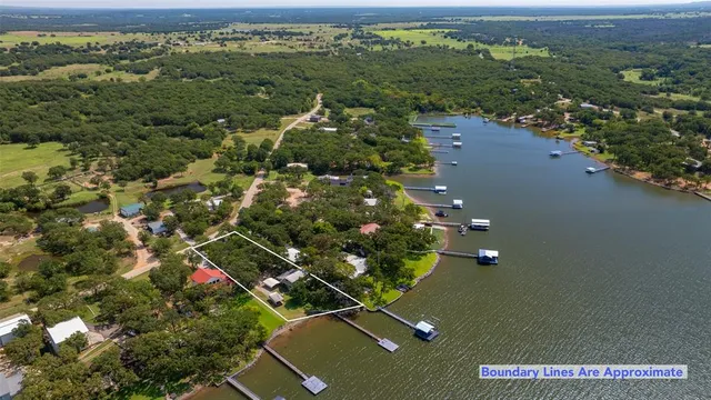 an aerial view of a residential houses with city view