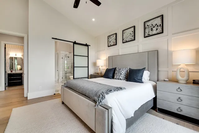 a living room with furniture and a large window with outer view