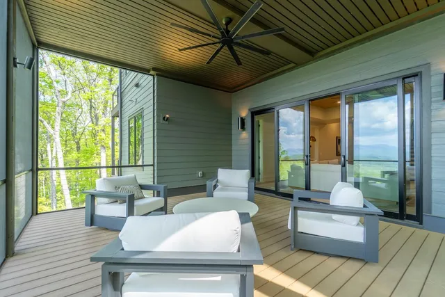 a bathroom with a toilet and a shower curtain
