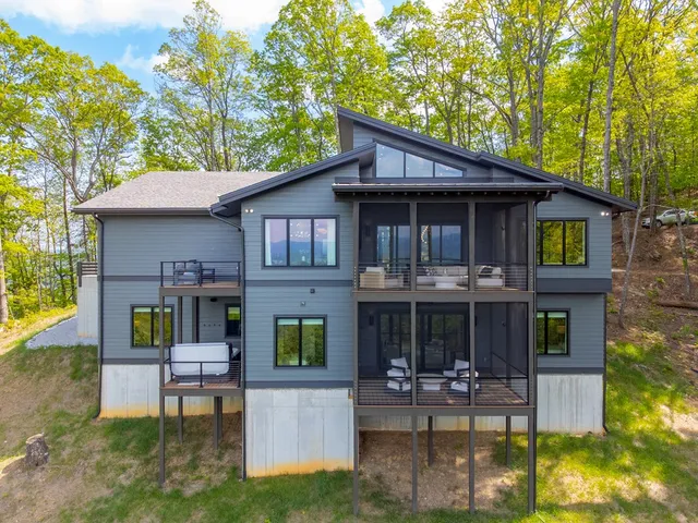 a view of a house with a patio and a garden