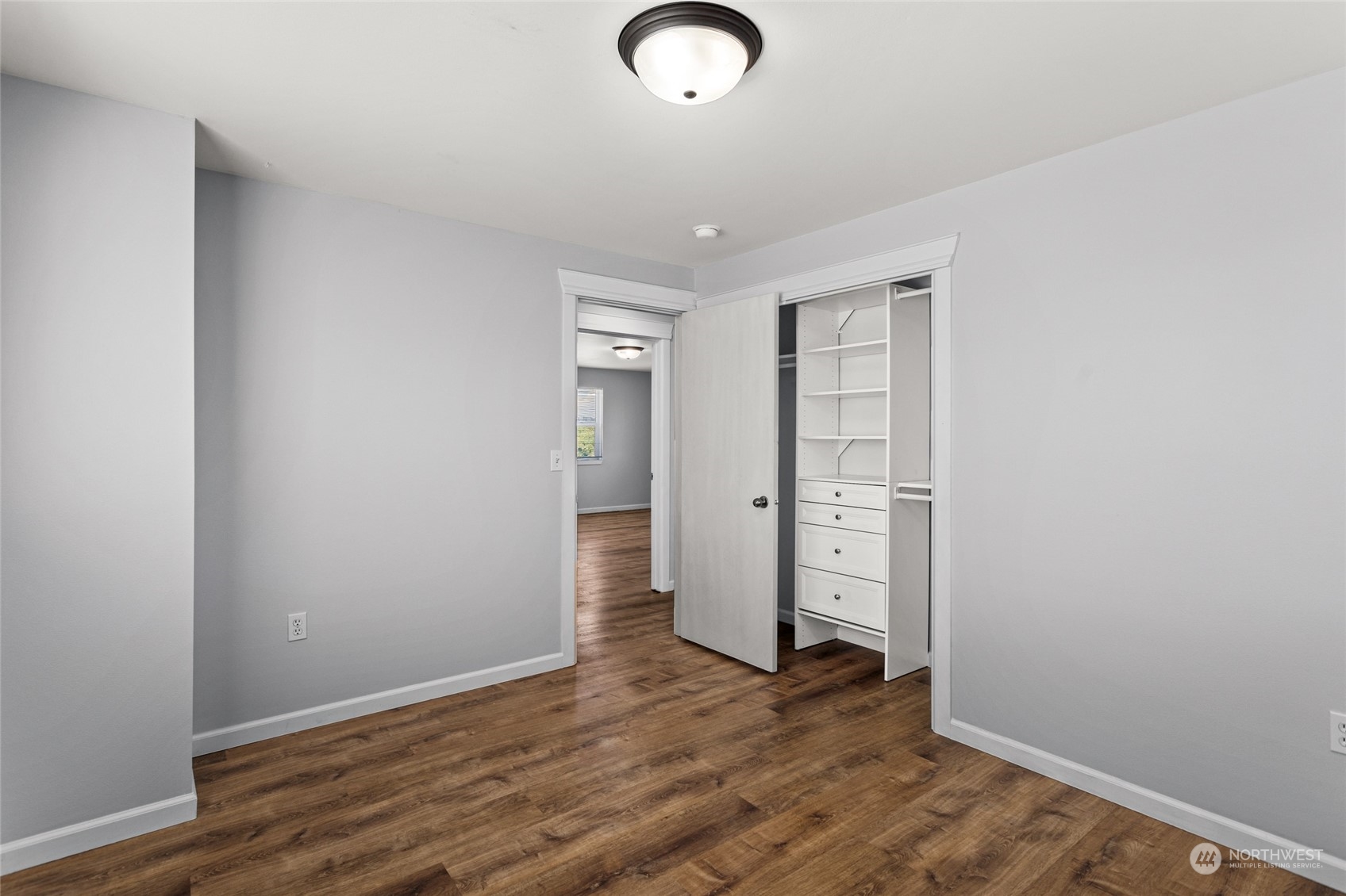 6504 Crestfields Road Yakima, WA 98903 - Photo 20 of 32 an empty room with wooden floor and windows