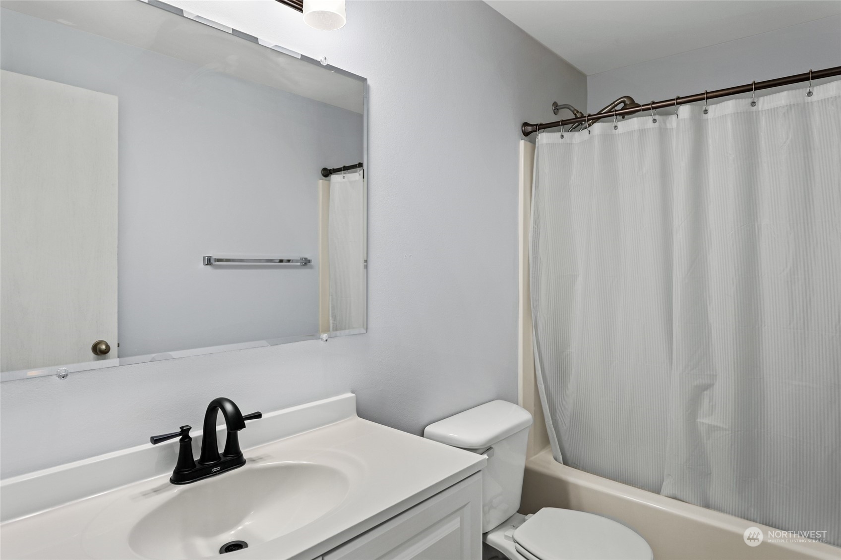 6504 Crestfields Road Yakima, WA 98903 - Photo 22 of 32 a bathroom with a sink and a mirror