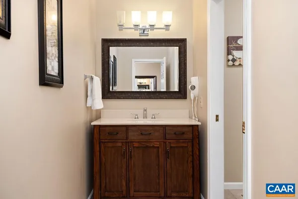 a white toilet sitting next to a bathroom sink