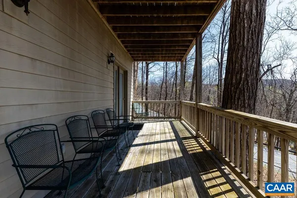 a view of balcony with wooden floor