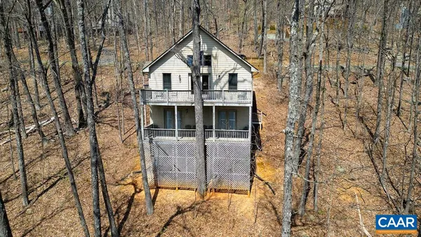 a view of a house with a iron gate