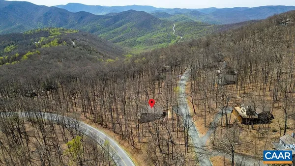 a view of a town with mountains in the background