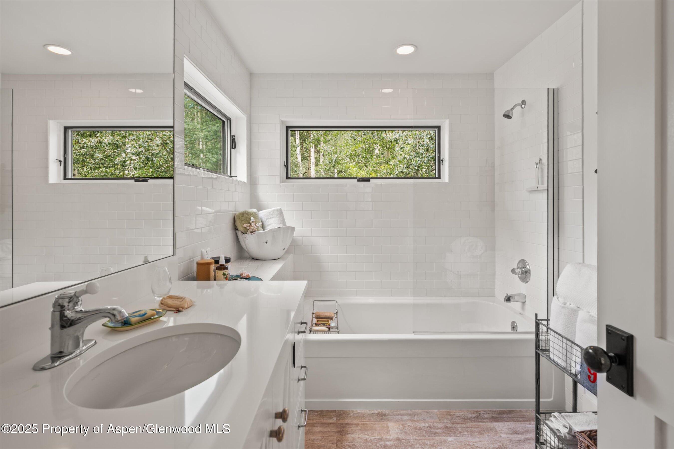 9555 Castle Creek Road Aspen, CO 81612 - Photo 31 of 42 a bathroom with a sink and a bathtub