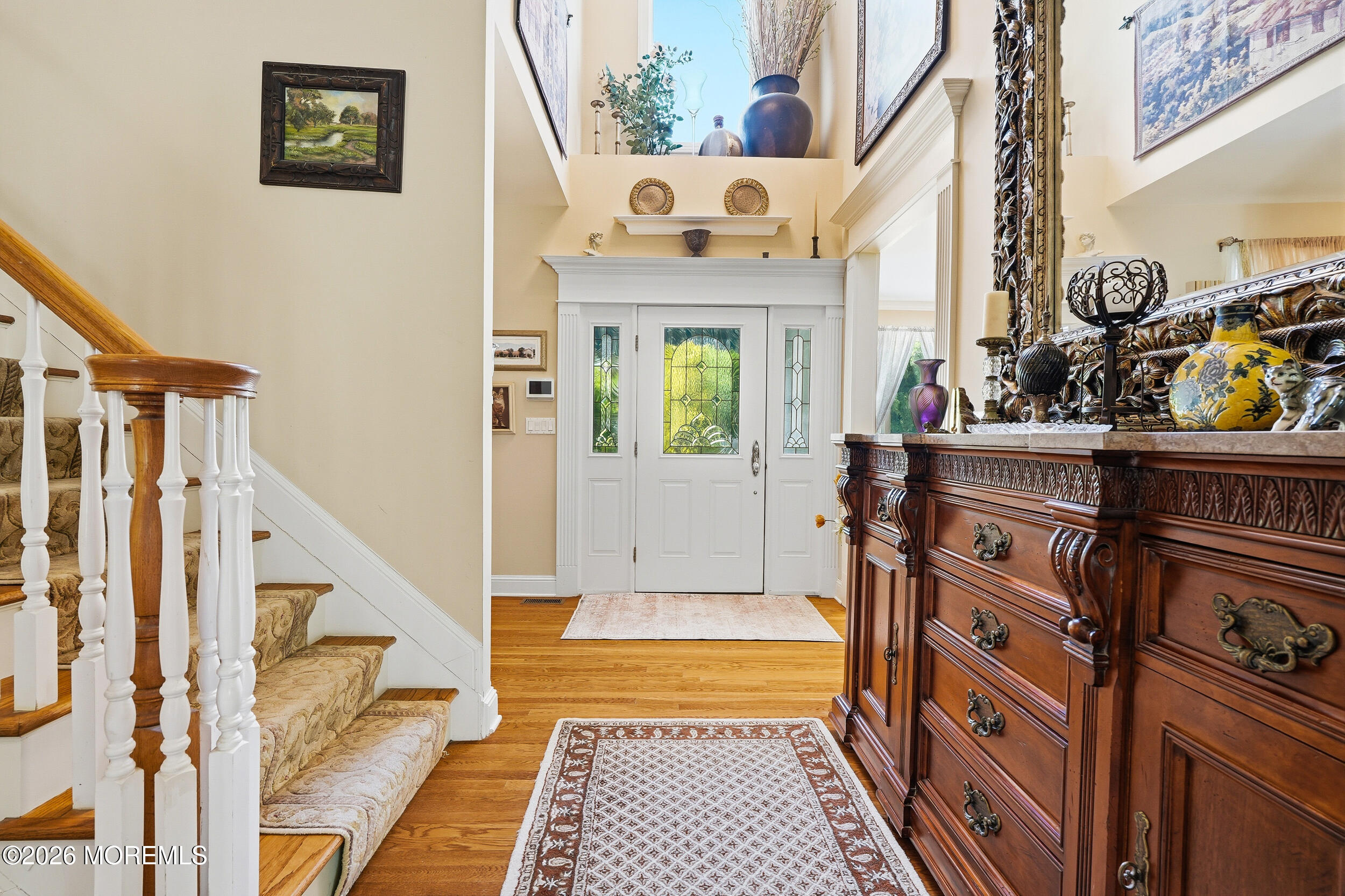 478 Rickey Lane Long Branch, NJ 07740 - Photo 19 of 64 a view of a hallway with a dining table and chairs