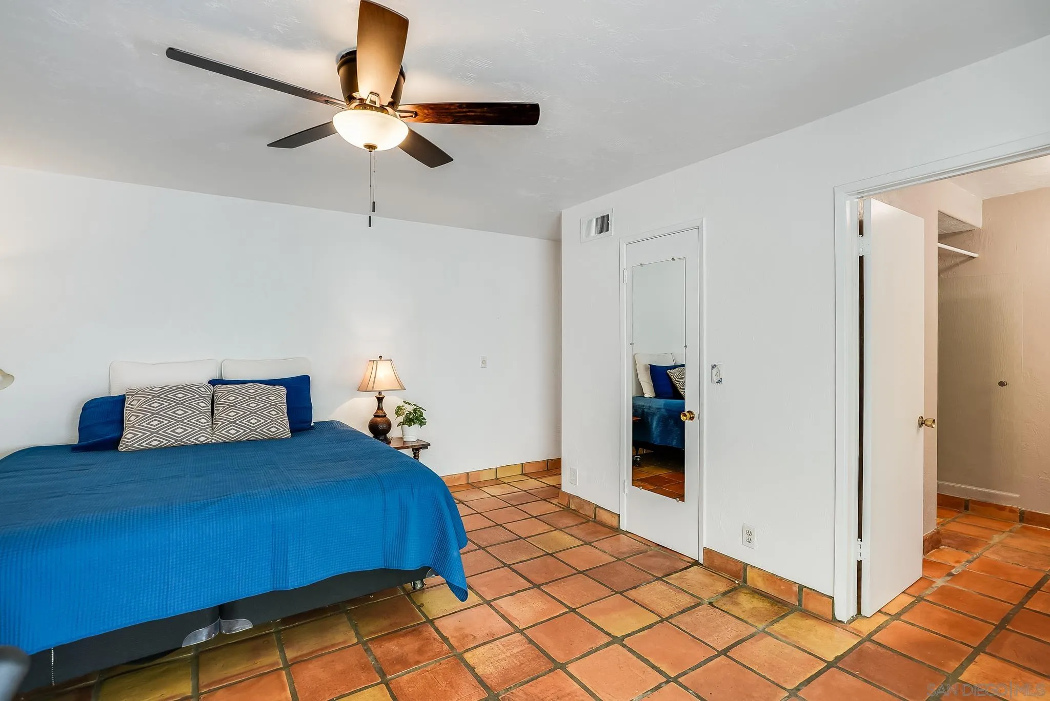 16672 Martincoit Road Poway, CA 92064 - Photo 29 of 71 a bedroom with bed and a chandelier