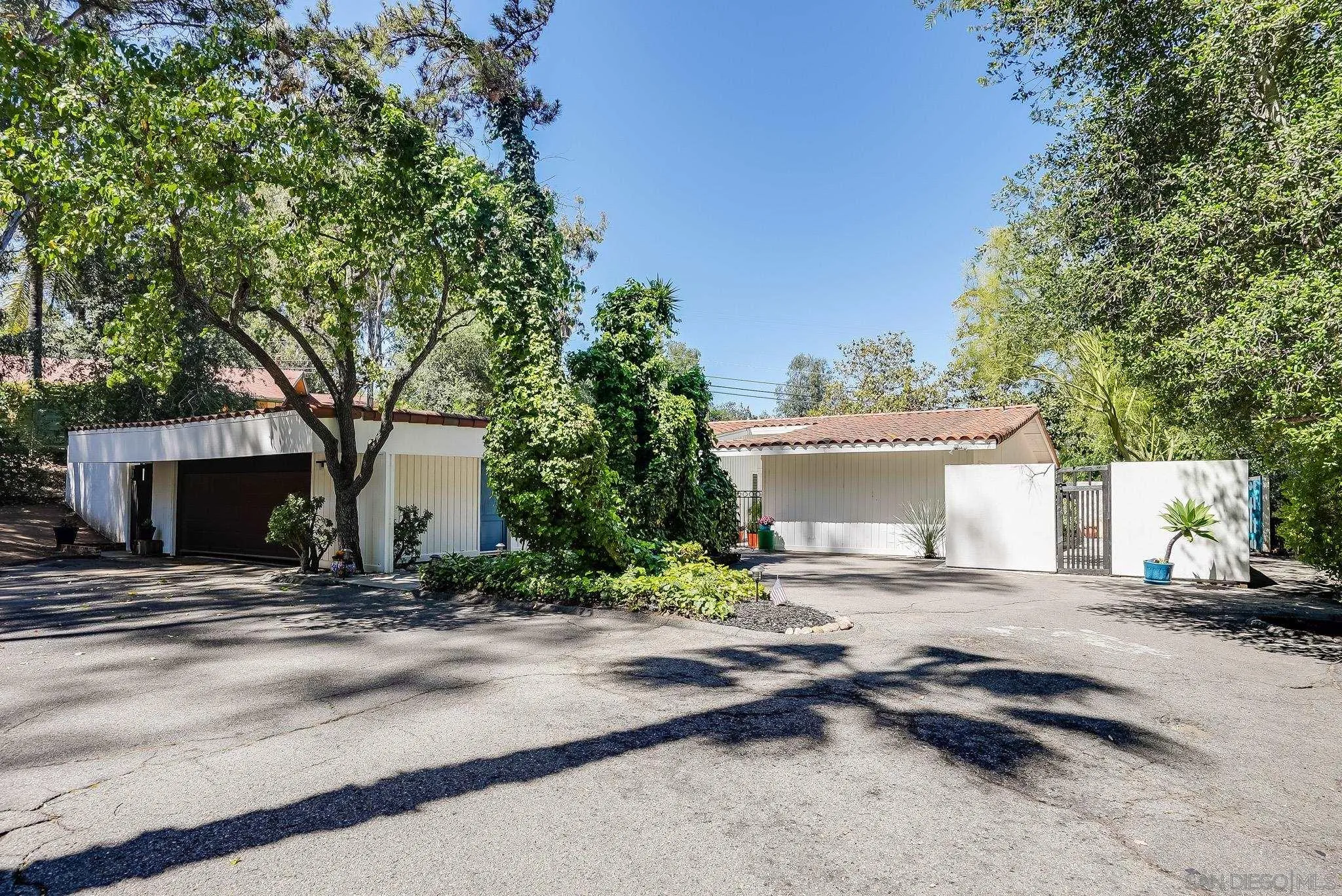 16672 Martincoit Road Poway, CA 92064 - Photo 3 of 71 a view of a house with a patio and a yard