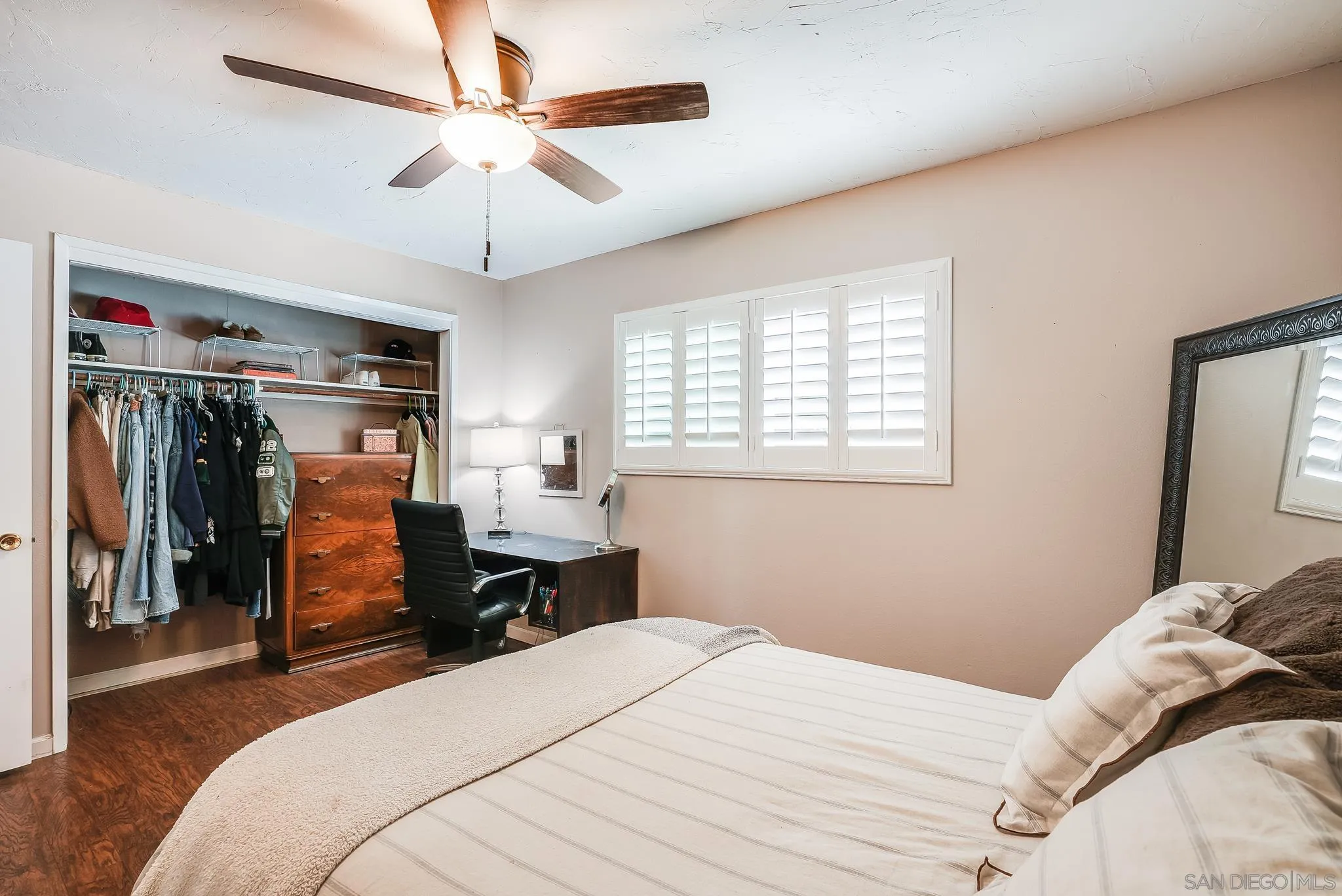 16672 Martincoit Road Poway, CA 92064 - Photo 33 of 71 a bedroom with a bed and a chandelier