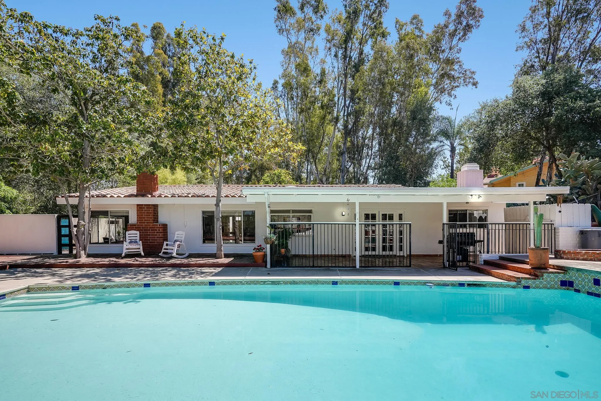 16672 Martincoit Road Poway, CA 92064 - Photo 50 of 71 a front view of a house with a yard table and chairs