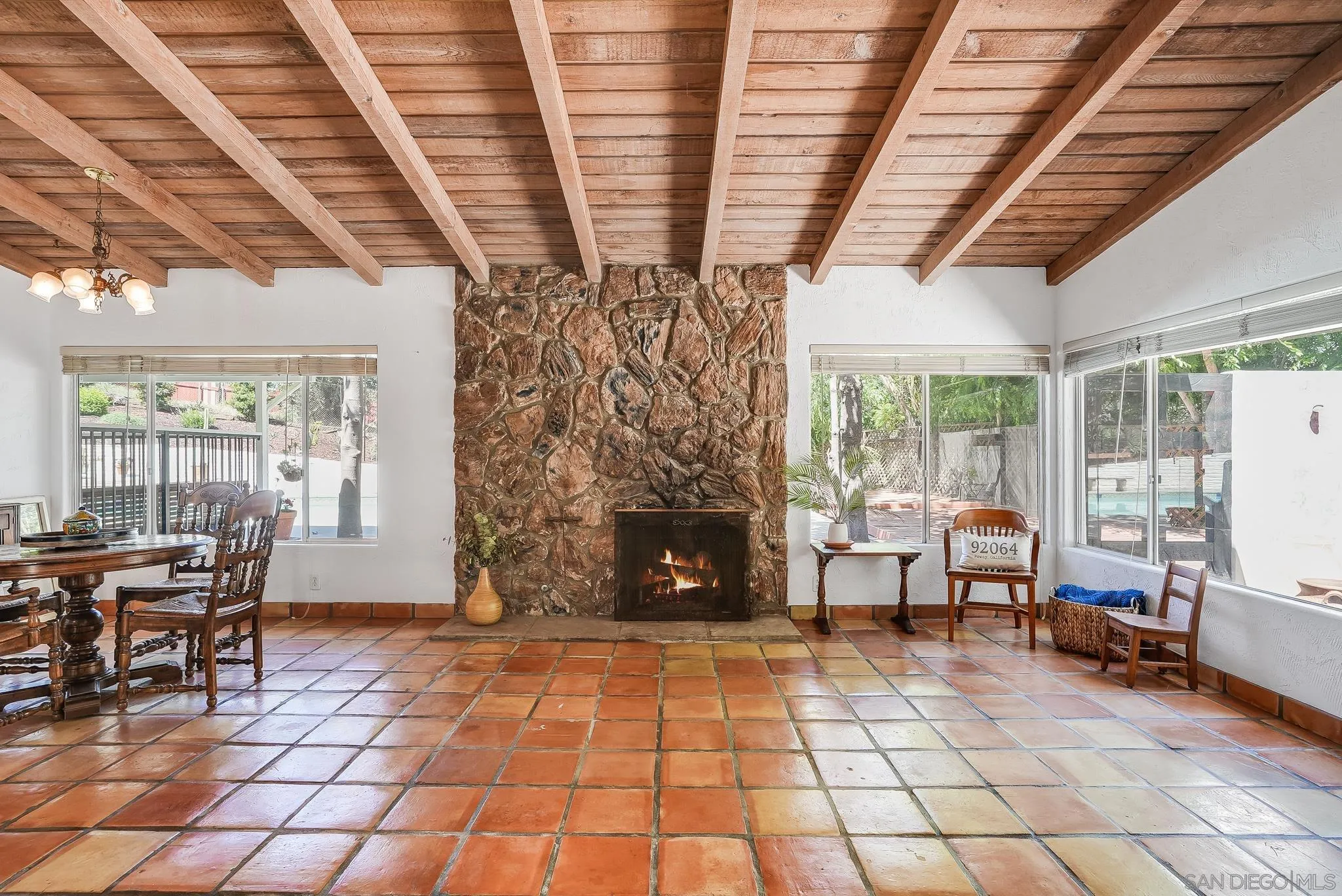 16672 Martincoit Road Poway, CA 92064 - Photo 10 of 71 a living room with patio furniture and a fireplace
