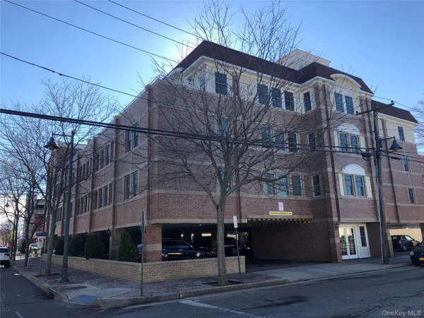 a front view of a building with street view
