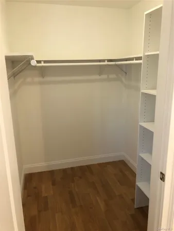wooden floor and cabinet in an empty room
