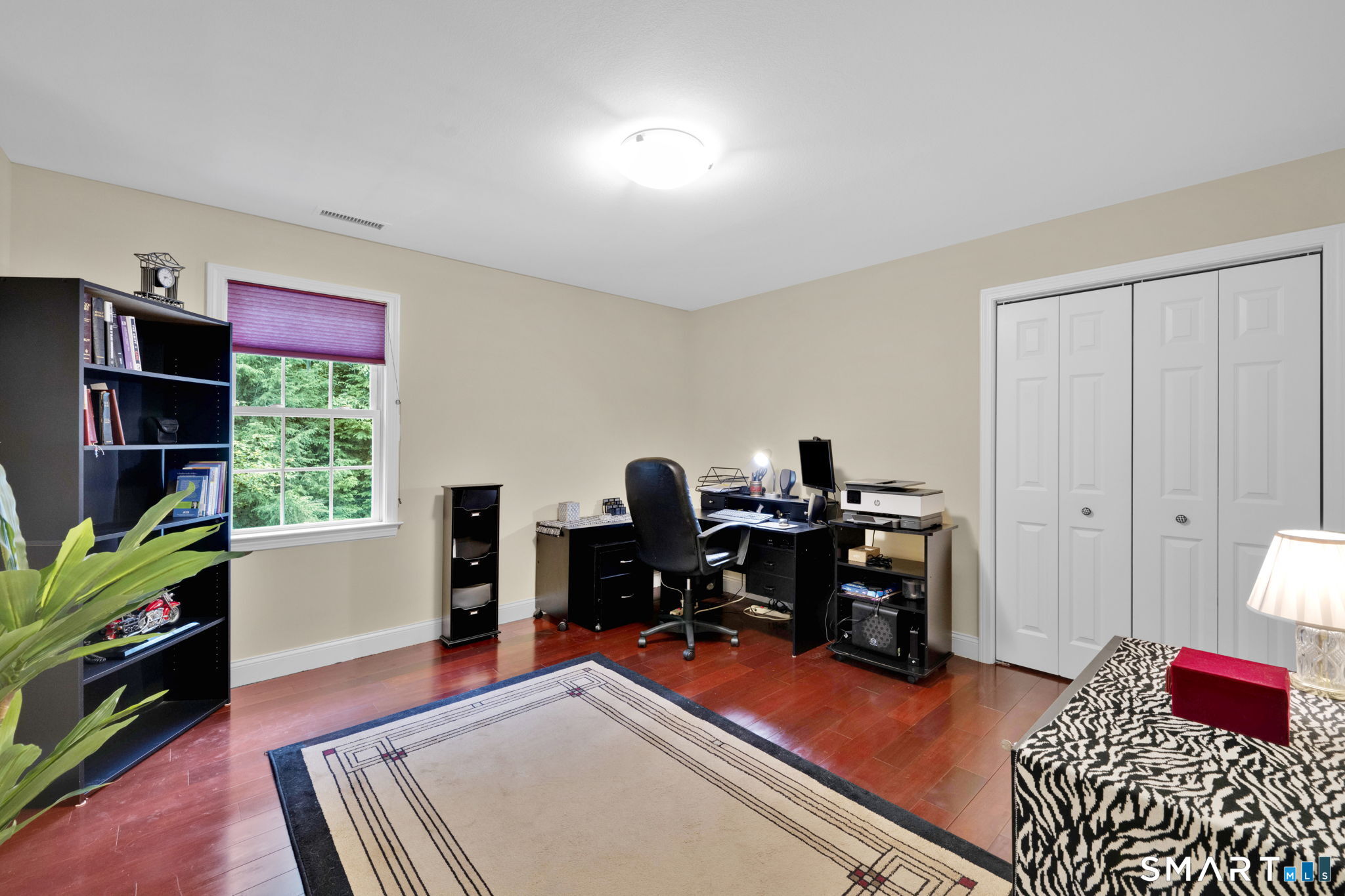5 Edwards Way Bloomfield, CT 06002 - Photo 24 of 40 Bedroom with large closet styled as an office, with hardwood floors.
