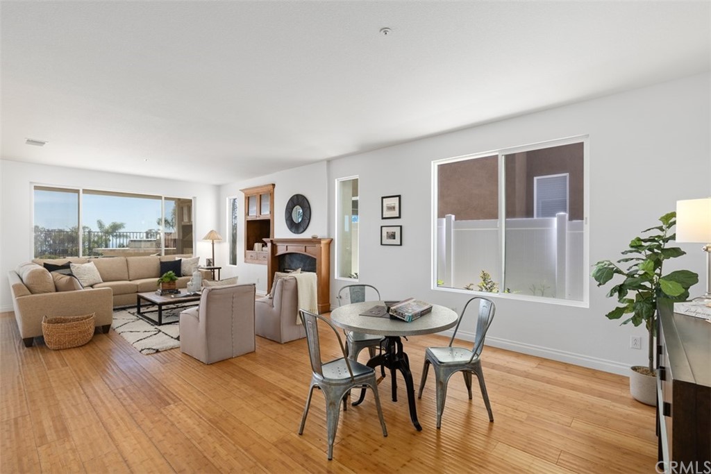 511 Avenida Ossa San Clemente, CA 92672 - Photo 12 of 49 a living room with fireplace furniture and a wooden floor