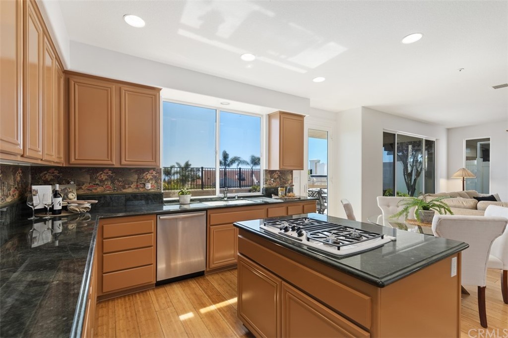 511 Avenida Ossa San Clemente, CA 92672 - Photo 14 of 49 a kitchen with a stove and a sink