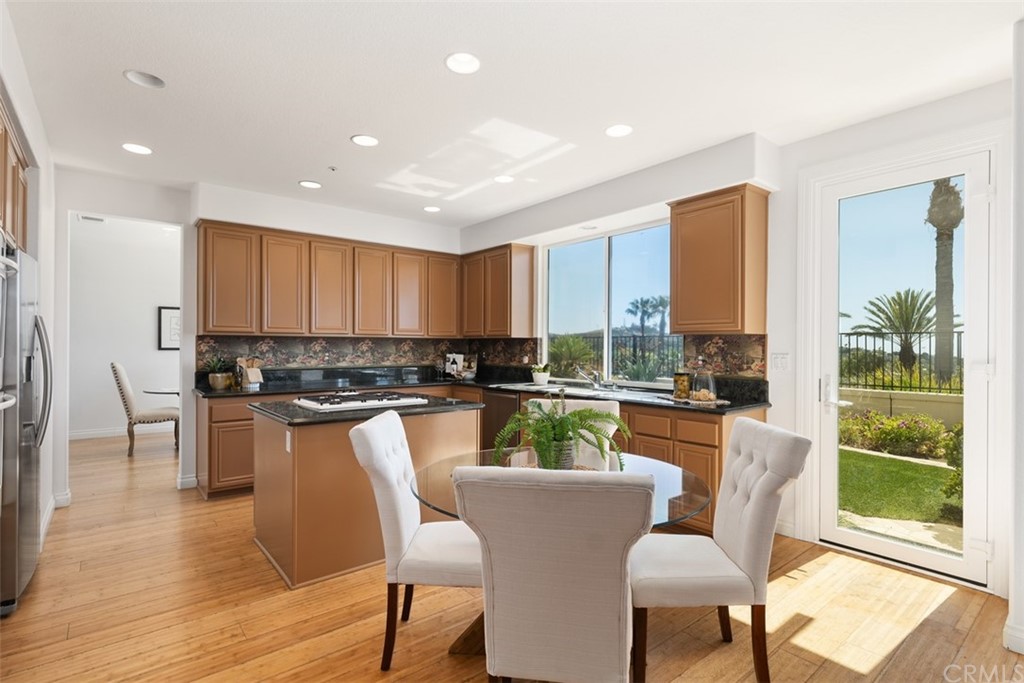 511 Avenida Ossa San Clemente, CA 92672 - Photo 16 of 49 a view of a dining room with furniture window and wooden floor